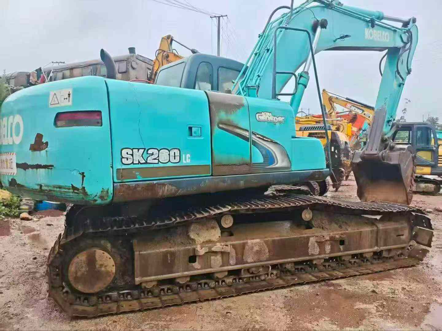 Buy Kobelco SK210 Used Excavator / 4