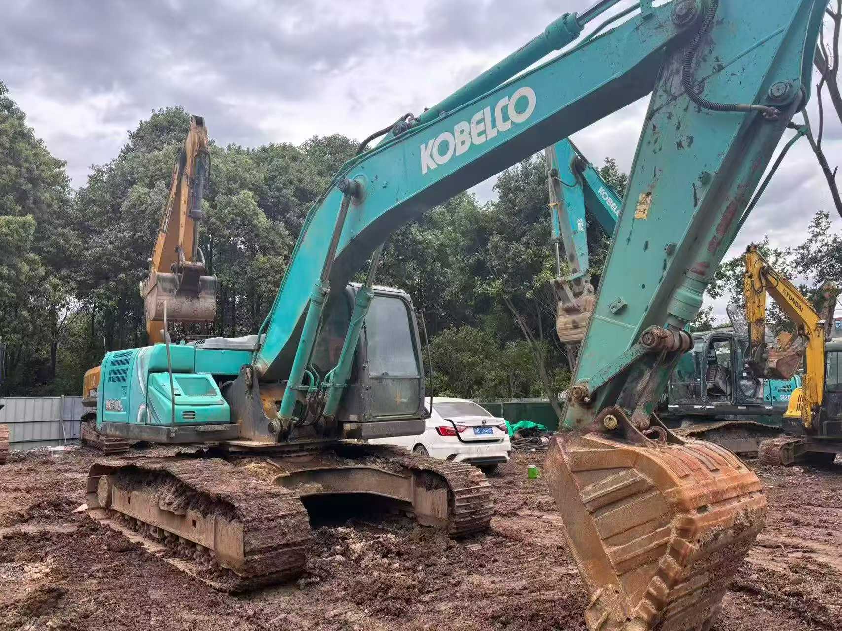 Buy Kobelco SK210 Used Excavator / 7