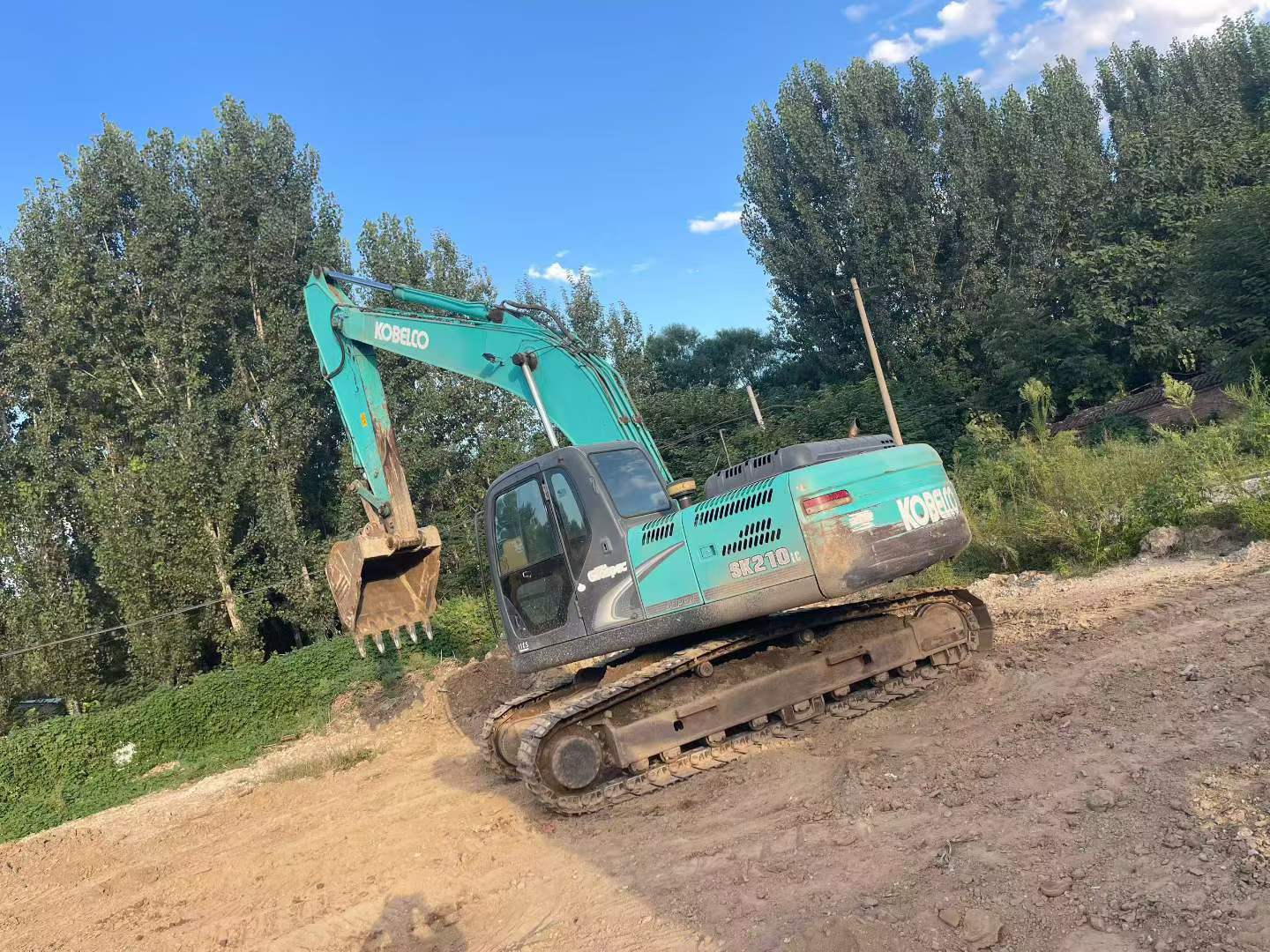 Buy Kobelco SK210 Used Excavator / 4